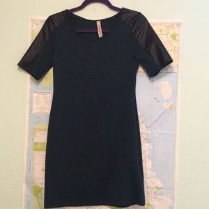 Teal dress with pleather shoulder detail.